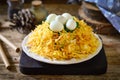 Russian salad wood grouse nest garnished with potato chips